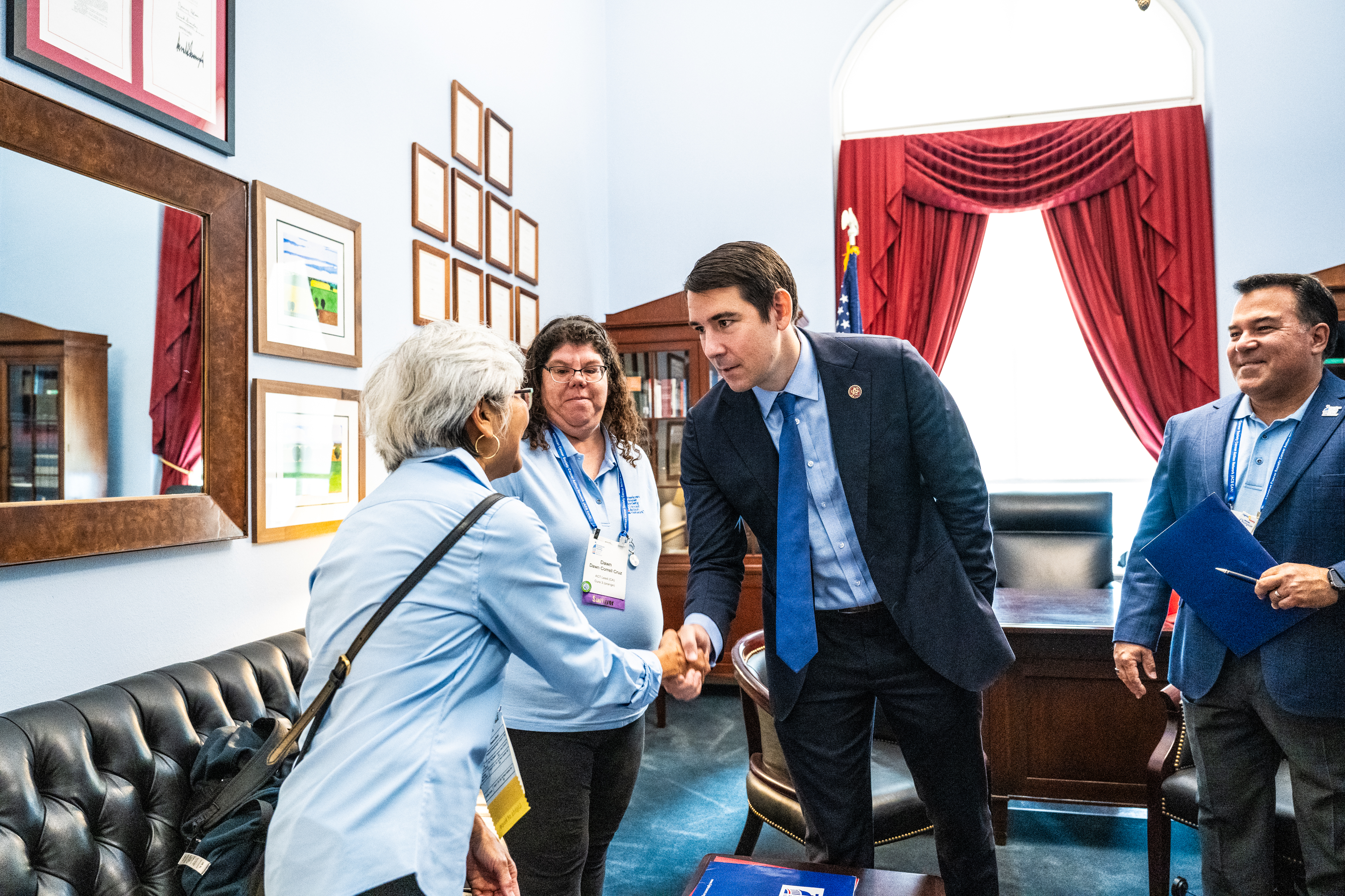 volunteers shaking hands with lawmaker