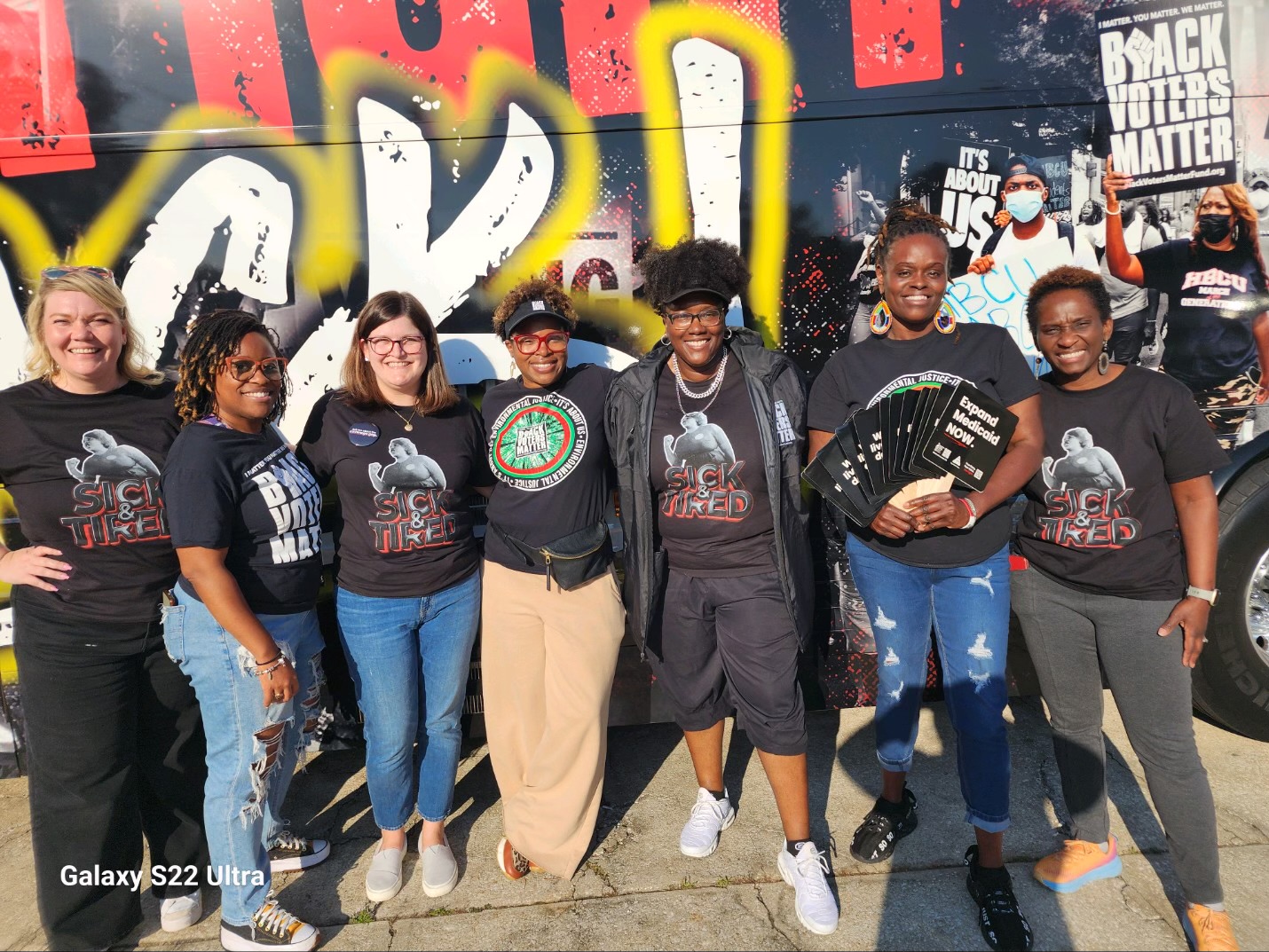 volunteers and team members at Sick and Tired bus tour