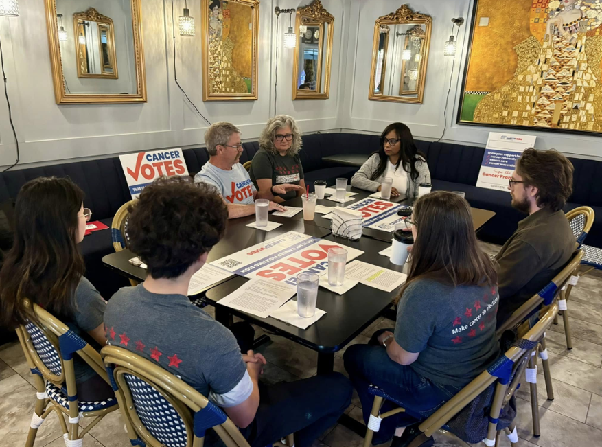 volunteers meeting at cancer votes event