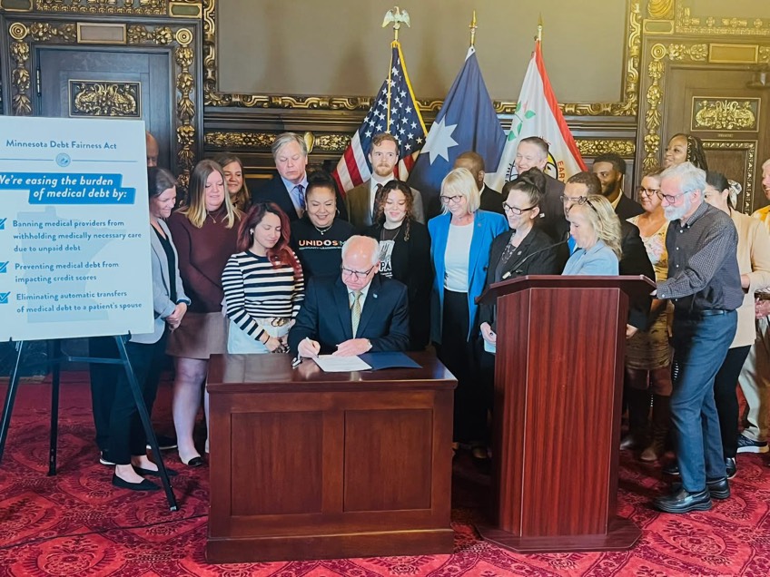 Tim Walz signing bill