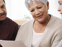 A man and two women reviewing medical information